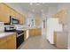 Open-concept kitchen featuring modern appliances and tile flooring at 3505 Tuscany Village Dr, Las Vegas, NV 89129
