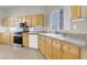 Well-equipped kitchen featuring modern appliances, granite countertops, and ample cabinet space at 3505 Tuscany Village Dr, Las Vegas, NV 89129