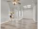 Open-concept living and dining area with new flooring and modern lighting at 3505 Tuscany Village Dr, Las Vegas, NV 89129