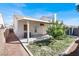 Outdoor space featuring a covered patio, landscaping, and partial view of the backyard at 3505 Tuscany Village Dr, Las Vegas, NV 89129