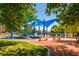 Vibrant playground with colorful structures, slides, and benches, perfect for recreation and outdoor fun at 3505 Tuscany Village Dr, Las Vegas, NV 89129