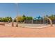 Outdoor basketball court surrounded by shade trees, offering a recreational space at 3505 Tuscany Village Dr, Las Vegas, NV 89129