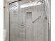 Modern tiled shower stall features a glass door, rainfall shower head and built-in niche at 3505 Tuscany Village Dr, Las Vegas, NV 89129