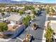 Palm-lined street with gated community entrance, providing a welcoming introduction at 3505 Tuscany Village Dr, Las Vegas, NV 89129