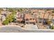 Aerial view of a two-story home with a red tile roof and solar panels in a suburban community at 3620 Bahama Bay Ct, Las Vegas, NV 89147