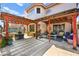 Covered backyard patio features an outdoor living space and patterned concrete flooring at 3620 Bahama Bay Ct, Las Vegas, NV 89147