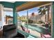 Backyard with a view of the sparkling pool, a rock waterfall feature and lush landscaping at 3620 Bahama Bay Ct, Las Vegas, NV 89147