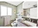 Updated bathroom with large vanity, sleek mirror, decorative wall art, and modern fixtures at 3620 Bahama Bay Ct, Las Vegas, NV 89147