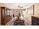 Traditional dining room with a beautiful china cabinet, chandelier, and a table set for eight at 3620 Bahama Bay Ct, Las Vegas, NV 89147