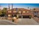 Two-story home featuring a red tile roof, neutral stucco, and a spacious three-car garage at 3620 Bahama Bay Ct, Las Vegas, NV 89147