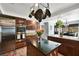 Gorgeous kitchen features a large island, stainless steel appliances, and dark wood cabinetry at 3620 Bahama Bay Ct, Las Vegas, NV 89147