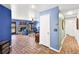 Cozy living room with brick fireplace, blue walls, and tile flooring at 3620 Bahama Bay Ct, Las Vegas, NV 89147