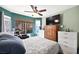 Main bedroom with large window, tile floors, and dresser at 3620 Bahama Bay Ct, Las Vegas, NV 89147