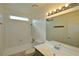 Bright bathroom with tub/shower combo, vanity, and updated lighting at 3630 Willow Springs Dr, Las Vegas, NV 89103