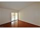 Bright bedroom features hardwood floors and a sliding glass door to the outside at 3630 Willow Springs Dr, Las Vegas, NV 89103