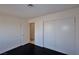 This bedroom offers a closet, wood floor, and neutral paint at 3630 Willow Springs Dr, Las Vegas, NV 89103