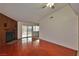 Living room featuring hardwood floors, fireplace, ceiling fan, and backyard access at 3630 Willow Springs Dr, Las Vegas, NV 89103