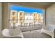 Relaxing balcony area with outdoor seating and a view of neighboring townhomes at 3772 Brilliant Sunset St, Las Vegas, NV 89129