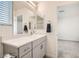 Bright bathroom featuring a sleek vanity, a large mirror, and modern fixtures at 3772 Brilliant Sunset St, Las Vegas, NV 89129