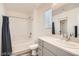 Bright bathroom featuring a shower/tub combo and a sleek vanity with modern fixtures at 3772 Brilliant Sunset St, Las Vegas, NV 89129