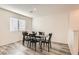 Bright dining room with six-chair table and natural light from a window at 3772 Brilliant Sunset St, Las Vegas, NV 89129