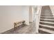 Hallway featuring a wooden bench seat, staircase, and gray laminate flooring at 3772 Brilliant Sunset St, Las Vegas, NV 89129