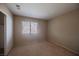 Bedroom with neutral walls, carpeted floors, and window letting in natural light at 4016 Fairport Dr, North Las Vegas, NV 89032