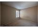 Bedroom with neutral walls, carpeted floors, and window letting in natural light at 4016 Fairport Dr, North Las Vegas, NV 89032