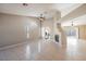 Open living room featuring tile flooring, fireplace, and lots of natural light at 4016 Fairport Dr, North Las Vegas, NV 89032