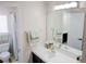 Bright bathroom showcasing a sink, large mirror, decorative towels, and access to a shower at 425 Donner Pass Dr, Henderson, NV 89014