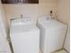 Clean laundry room with a white washing machine and dryer set at 425 Donner Pass Dr, Henderson, NV 89014