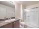 Bathroom featuring a shower with glass doors and granite countertops at 4542 Townwall St, Las Vegas, NV 89115