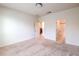 Spacious bedroom with neutral carpeting and a view into the bathroom and closet at 4542 Townwall St, Las Vegas, NV 89115