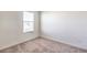 Bedroom featuring a window and neutral carpeting at 4542 Townwall St, Las Vegas, NV 89115