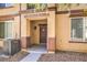 Close up of a townhouse facade with a welcoming entrance and visible address number, showing a well-maintained exterior at 4542 Townwall St, Las Vegas, NV 89115