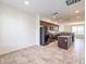 Open concept kitchen showcasing stainless appliances, tile flooring, and modern cabinetry at 4542 Townwall St, Las Vegas, NV 89115