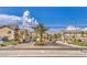 Entry into the Cliffs at Dover neighborhood showcases manicured landscaping and inviting architecture at 4542 Townwall St, Las Vegas, NV 89115