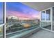 Balcony overlooking city views through modern glass railings and large windows, bathed in evening light at 4575 Dean Martin Dr # 3009, Las Vegas, NV 89103