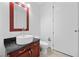 Well-lit bathroom with modern vanity, toilet, and doorway at 4575 Dean Martin Dr # 3009, Las Vegas, NV 89103