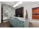 Modern bathroom featuring a unique blue-tiled sink, frosted glass shower, and spacious design at 4575 Dean Martin Dr # 3009, Las Vegas, NV 89103