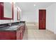 Bathroom featuring a double vanity, soaking tub, and dark wood cabinets at 4575 Dean Martin Dr # 3009, Las Vegas, NV 89103