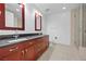 Bathroom featuring double vanity with dark wood cabinets and large mirror at 4575 Dean Martin Dr # 3009, Las Vegas, NV 89103