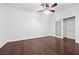 Bedroom featuring dark wood floors, a ceiling fan, and a closet at 4575 Dean Martin Dr # 3009, Las Vegas, NV 89103