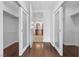 Hallway showcasing the dark wood flooring and access to the bathroom and closets at 4575 Dean Martin Dr # 3009, Las Vegas, NV 89103