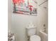 This bathroom features a toilet, bathtub, shower, and art at 4786 Valleyside Ave, Las Vegas, NV 89115