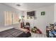 Bedroom featuring a window with blinds, a ceiling light, and decor at 4786 Valleyside Ave, Las Vegas, NV 89115