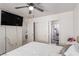 Bedroom with white walls, light gray floors and ensuite bathroom at 4786 Valleyside Ave, Las Vegas, NV 89115