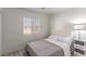 Bedroom with a window with blinds, and a nightstand with a decorative lamp at 4786 Valleyside Ave, Las Vegas, NV 89115