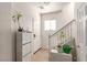 Bright entryway featuring a tiled floor, white walls, and a staircase, creating a welcoming and airy entrance at 4786 Valleyside Ave, Las Vegas, NV 89115