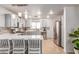 Bright kitchen with modern appliances, breakfast bar, light blue cabinets and tiled backsplash at 4786 Valleyside Ave, Las Vegas, NV 89115